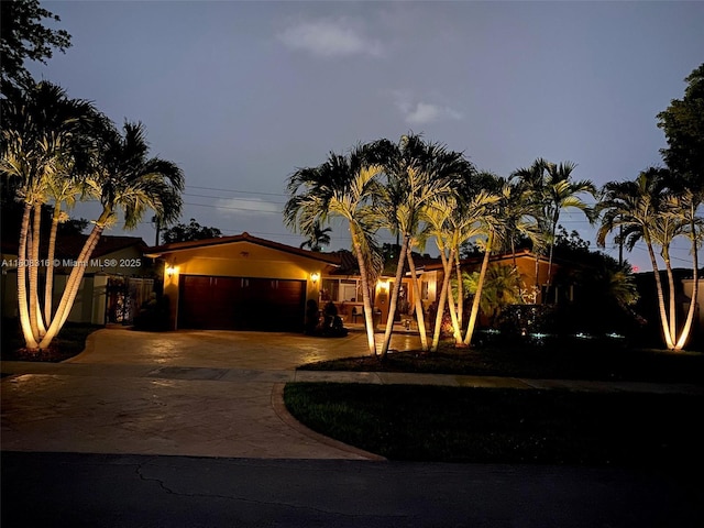 991 Dove Ave, Miami Springs, FL 33166 - view of front of property with a garage and concrete driveway