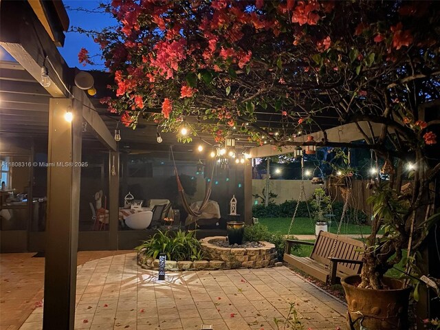 991 Dove Ave, Miami Springs, FL 33166 - patio at twilight with a patio