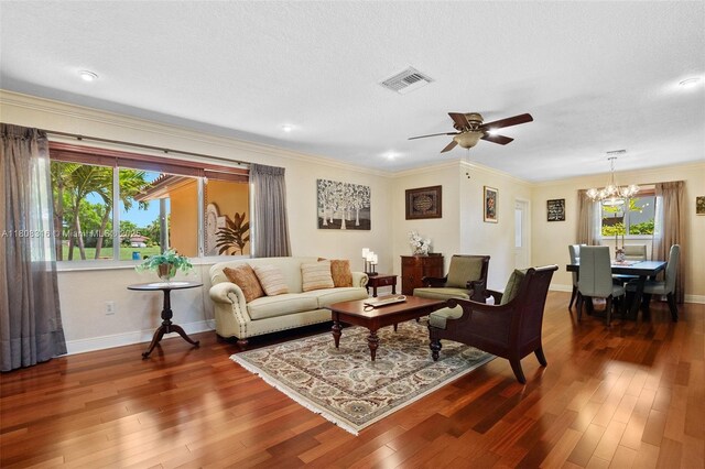 991 Dove Ave, Miami Springs, FL 33166 - living area featuring a chandelier, ceiling fan, dark wood-style floors, baseboards, and recessed lighting