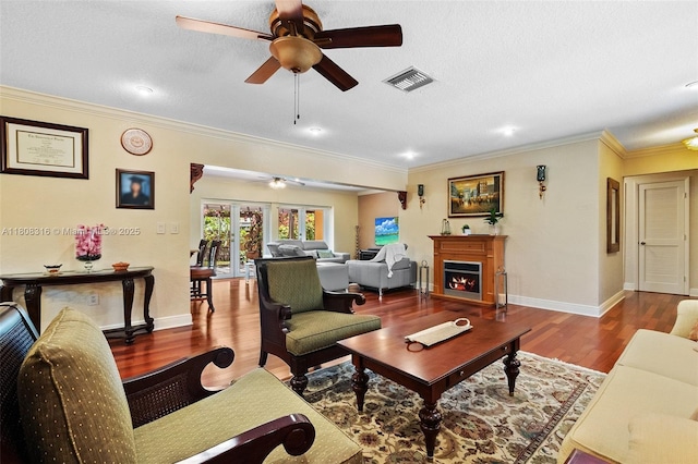 991 Dove Ave, Miami Springs, FL 33166 - living room with ceiling fan, crown molding, wood finished floors, baseboards, and a lit fireplace