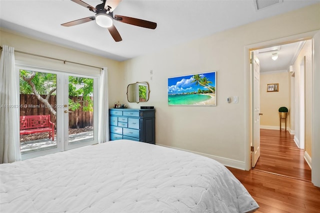991 Dove Ave, Miami Springs, FL 33166 - bedroom with access to outside, wood finished floors, baseboards, and french doors