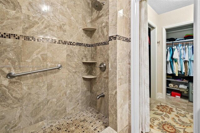 991 Dove Ave, Miami Springs, FL 33166 - bathroom featuring a stall shower and a spacious closet