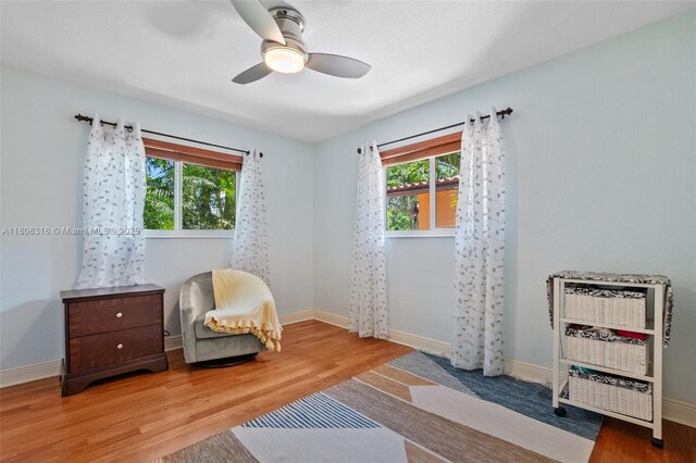991 Dove Ave, Miami Springs, FL 33166 - living area featuring healthy amount of natural light, wood finished floors, ceiling fan, and heating unit