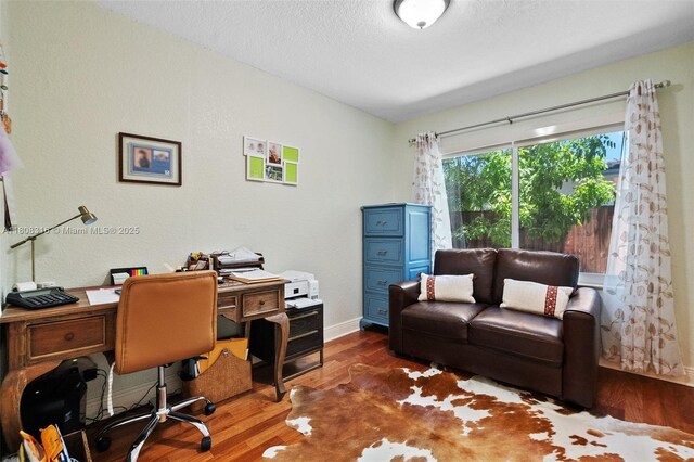991 Dove Ave, Miami Springs, FL 33166 - office space with wood finished floors, baseboards, and a textured ceiling