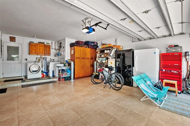 991 Dove Ave, Miami Springs, FL 33166 - garage featuring washer / dryer, a garage door opener, and black fridge with ice dispenser
