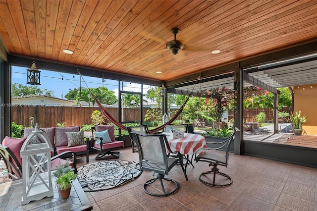 991 Dove Ave, Miami Springs, FL 33166 - sunroom / solarium with outdoor lounge area, wood ceiling, outdoor dining area, and ceiling fan