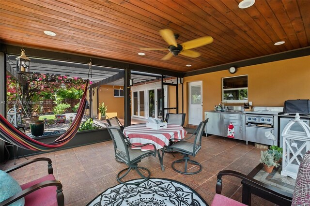 991 Dove Ave, Miami Springs, FL 33166 - view of patio featuring outdoor dining area, an outdoor kitchen, ceiling fan, and a sink