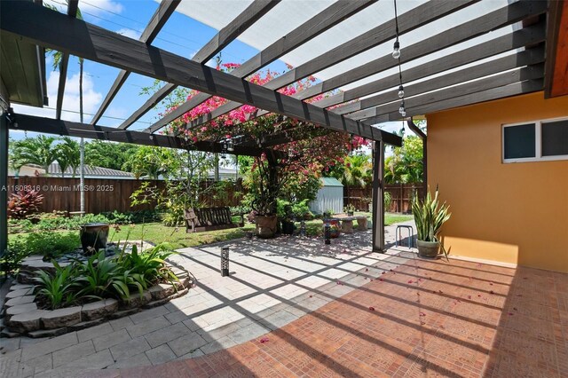 991 Dove Ave, Miami Springs, FL 33166 - fenced backyard featuring a patio area and a pergola
