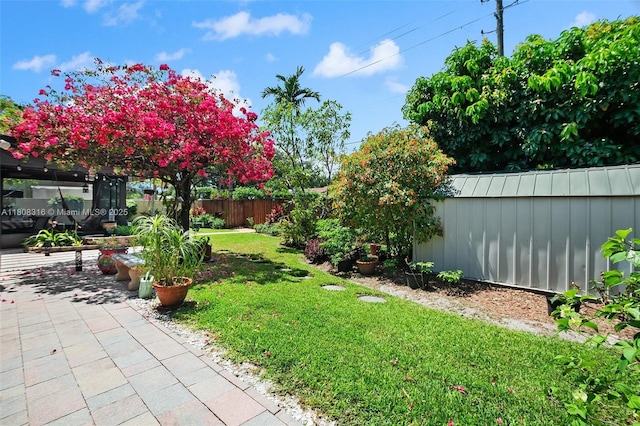 991 Dove Ave, Miami Springs, FL 33166 - view of yard featuring an outbuilding and a patio area