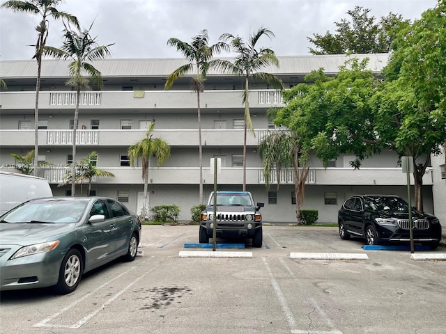 17255 SW 95th Ave Unit D-349, Palmetto Bay, FL 33157 - view of building exterior featuring uncovered parking