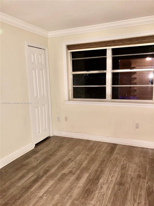 17255 SW 95th Ave Unit D-349, Palmetto Bay, FL 33157 - empty room featuring crown molding, wood finished floors, and baseboards