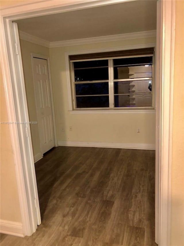 17255 SW 95th Ave Unit D-349, Palmetto Bay, FL 33157 - empty room featuring dark wood-type flooring, ornamental molding, and baseboards