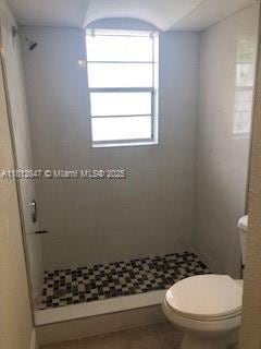 17255 SW 95th Ave Unit D-349, Palmetto Bay, FL 33157 - bathroom with a stall shower, toilet, and tile patterned floors