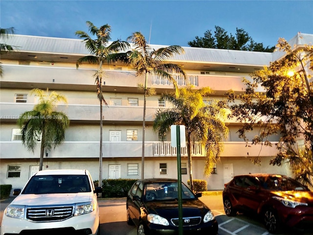 17255 SW 95th Ave Unit D-349, Palmetto Bay, FL 33157 - view of building exterior featuring uncovered parking