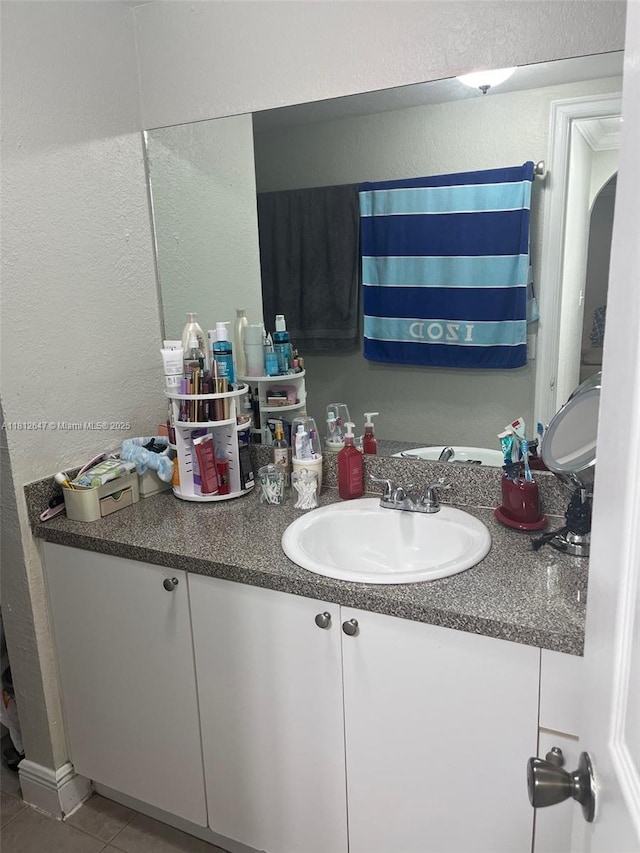 17255 SW 95th Ave Unit D-349, Palmetto Bay, FL 33157 - bathroom with a textured wall, vanity, and tile patterned floors