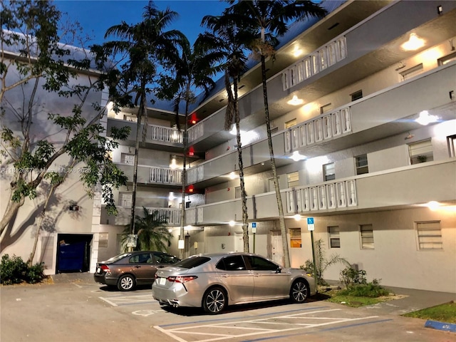 17255 SW 95th Ave Unit D-349, Palmetto Bay, FL 33157 - view of building exterior featuring uncovered parking