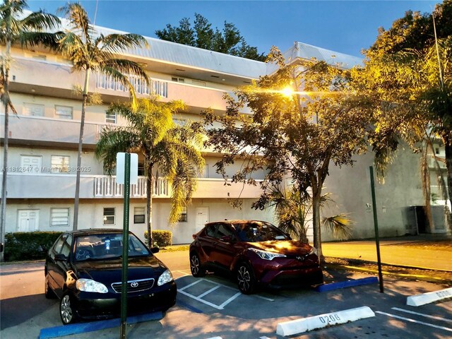 17255 SW 95th Ave Unit D-349, Palmetto Bay, FL 33157 - view of building exterior featuring uncovered parking