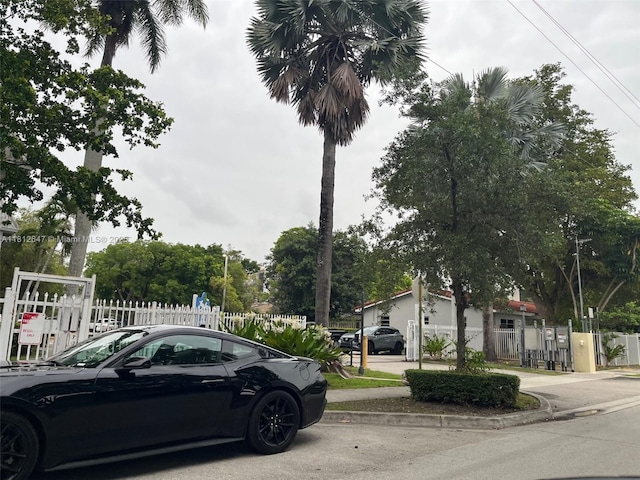 17255 SW 95th Ave Unit D-349, Palmetto Bay, FL 33157 - view of asphalt road featuring sidewalks and curbs