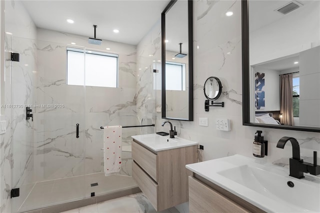 2320 SW 14th St, Miami, FL 33145 - bathroom with a marble finish shower and two vanities