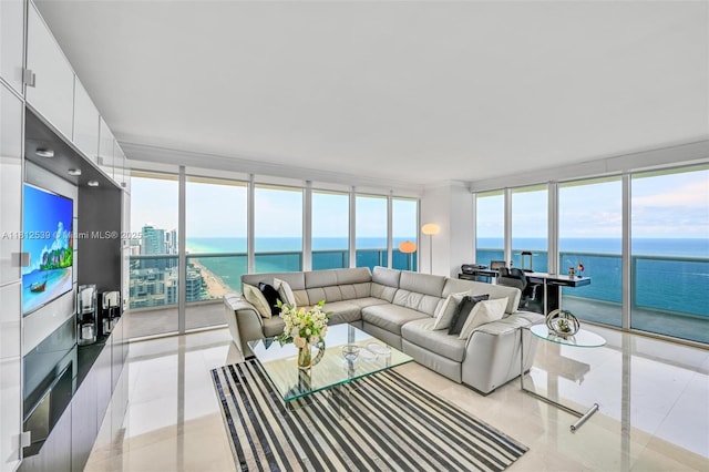 1830 S Ocean Dr Unit 3801, Hallandale Beach, FL 33009 - living area with floor to ceiling windows, a water view, and light tile patterned flooring