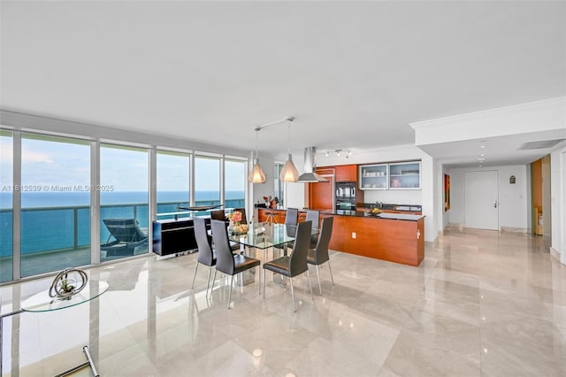 1830 S Ocean Dr Unit 3801, Hallandale Beach, FL 33009 - dining space featuring light marble finish floors, a water view, and ornamental molding
