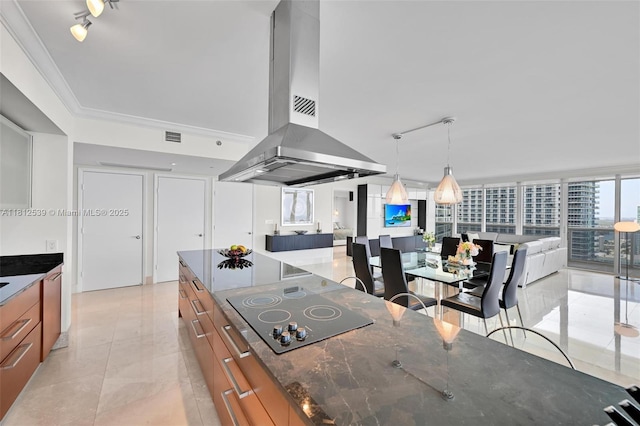 1830 S Ocean Dr Unit 3801, Hallandale Beach, FL 33009 - kitchen with island exhaust hood, black electric cooktop, brown cabinets, open floor plan, and modern cabinets
