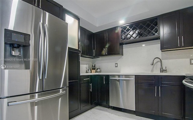 4156 Inverrary Dr Unit 204, Lauderhill, FL 33319 - kitchen with stainless steel appliances, light marble finish floors, a sink, light countertops, and dark cabinets