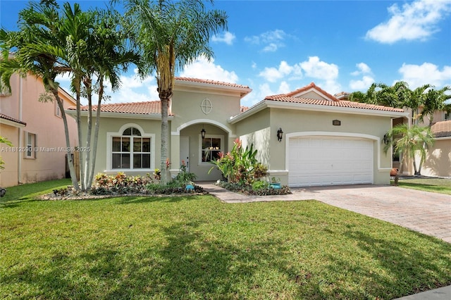 2046 SE 18th St, Homestead, FL 33035 - mediterranean / spanish-style home with a garage, driveway, a tiled roof, a front yard, and stucco siding