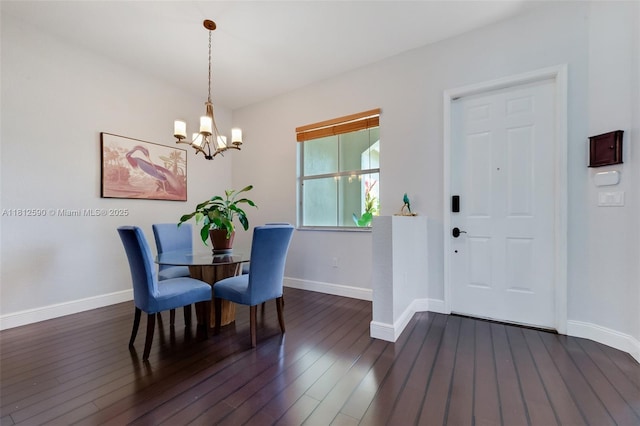 2046 SE 18th St, Homestead, FL 33035 - dining space with a chandelier, dark wood-style floors, and baseboards
