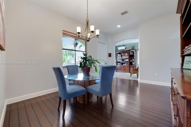 2046 SE 18th St, Homestead, FL 33035 - dining room with arched walkways, a chandelier, dark wood finished floors, baseboards, and recessed lighting