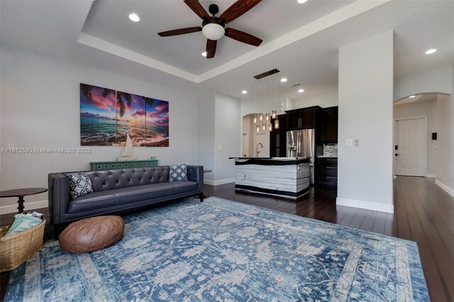 2046 SE 18th St, Homestead, FL 33035 - living room featuring arched walkways, a ceiling fan, dark wood-style flooring, baseboards, and recessed lighting
