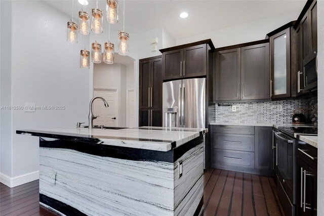 2046 SE 18th St, Homestead, FL 33035 - kitchen with stainless steel appliances, dark wood-style flooring, backsplash, dark brown cabinets, and recessed lighting