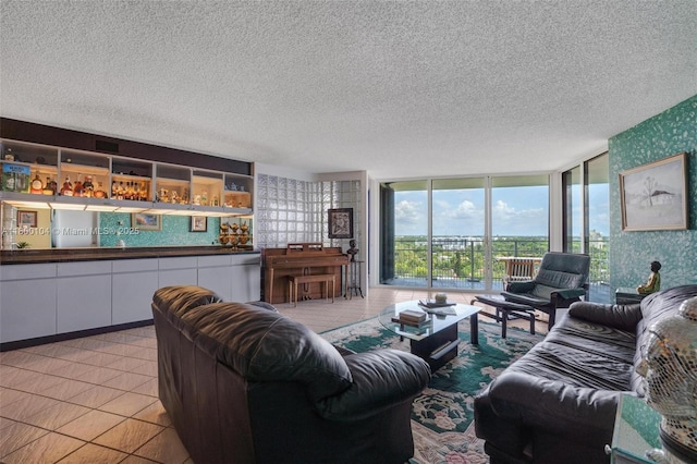 4000 Towerside Ter Unit 1403, Miami, FL 33138 - living room featuring a textured ceiling and light tile patterned floors