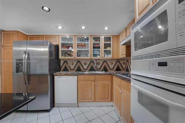 4000 Towerside Ter Unit 1403, Miami, FL 33138 - kitchen featuring white appliances, glass insert cabinets, dark stone counters, light tile patterned floors, and recessed lighting