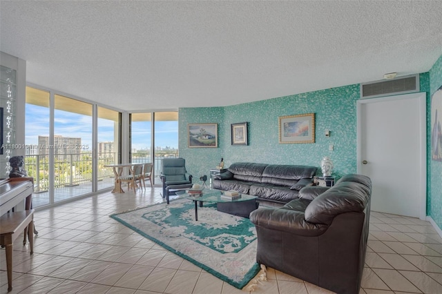4000 Towerside Ter Unit 1403, Miami, FL 33138 - living area with a textured ceiling, floor to ceiling windows, and light tile patterned floors