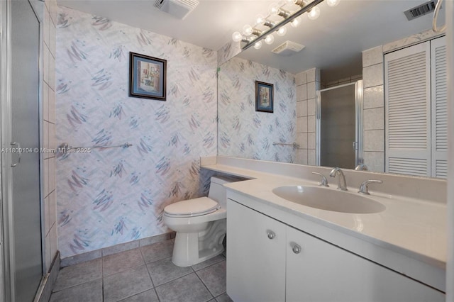 4000 Towerside Ter Unit 1403, Miami, FL 33138 - bathroom featuring tile patterned floors, toilet, vanity, baseboards, and a shower with shower door