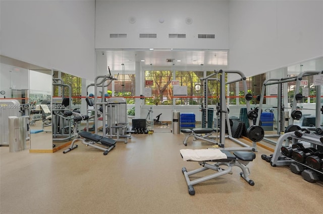 4000 Towerside Ter Unit 1403, Miami, FL 33138 - workout area featuring a towering ceiling