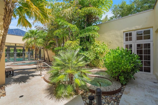 4000 Towerside Ter Unit 1403, Miami, FL 33138 - view of patio / terrace featuring an in-ground hot tub and an outdoor pool