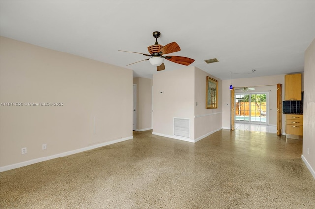4051 NE 17th Ter, Pompano Beach, FL 33064 - unfurnished living room featuring a ceiling fan, speckled floor, and baseboards