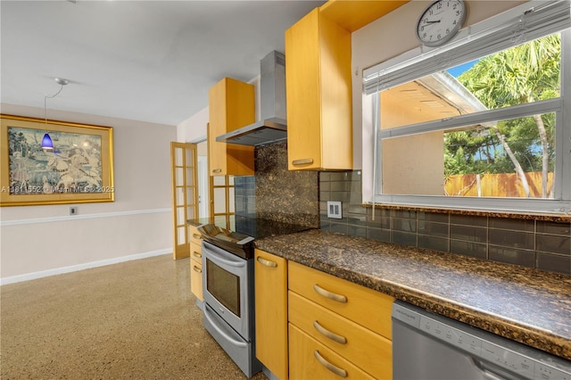 4051 NE 17th Ter, Pompano Beach, FL 33064 - kitchen with stainless steel appliances, wall chimney range hood, backsplash, and dark countertops