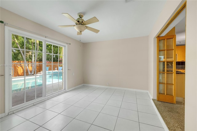 4051 NE 17th Ter, Pompano Beach, FL 33064 - spare room with a ceiling fan and baseboards