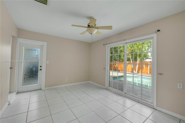 4051 NE 17th Ter, Pompano Beach, FL 33064 - spare room featuring ceiling fan, baseboards, and light tile patterned floors