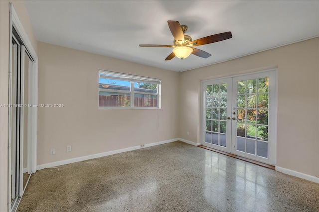 4051 NE 17th Ter, Pompano Beach, FL 33064 - spare room with french doors, baseboards, a ceiling fan, and speckled floor