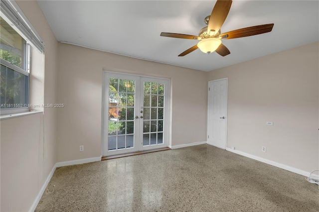 4051 NE 17th Ter, Pompano Beach, FL 33064 - empty room with french doors, speckle patterned floor, ceiling fan, and baseboards