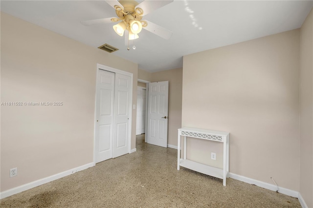 4051 NE 17th Ter, Pompano Beach, FL 33064 - unfurnished bedroom featuring baseboards, a closet, and a ceiling fan