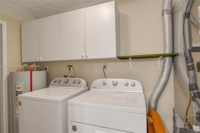 4051 NE 17th Ter, Pompano Beach, FL 33064 - laundry room with washing machine and dryer, electric water heater, and cabinet space