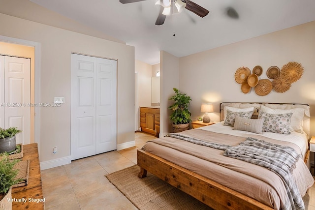 17368 SW 22nd Ct, Miramar, FL 33029 - bedroom with light tile patterned flooring, baseboards, ensuite bath, ceiling fan, and a closet