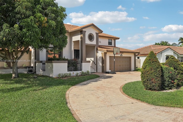 15050 E Falcons Lea Dr, Davie, FL 33331 - mediterranean / spanish-style home featuring a tiled roof, decorative driveway, stucco siding, and a front yard