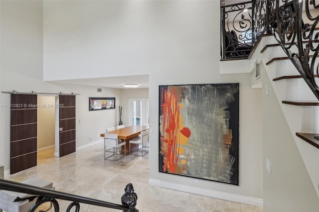 15050 E Falcons Lea Dr, Davie, FL 33331 - stairs featuring a towering ceiling and baseboards
