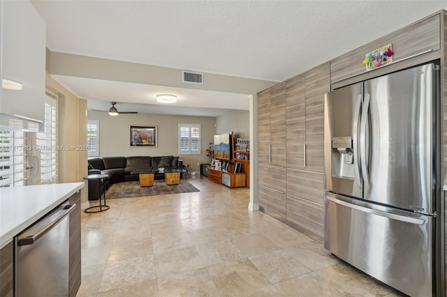 15050 E Falcons Lea Dr, Davie, FL 33331 - kitchen with stainless steel appliances, light countertops, a ceiling fan, modern cabinets, and open floor plan